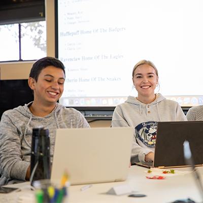 Two students on computers.